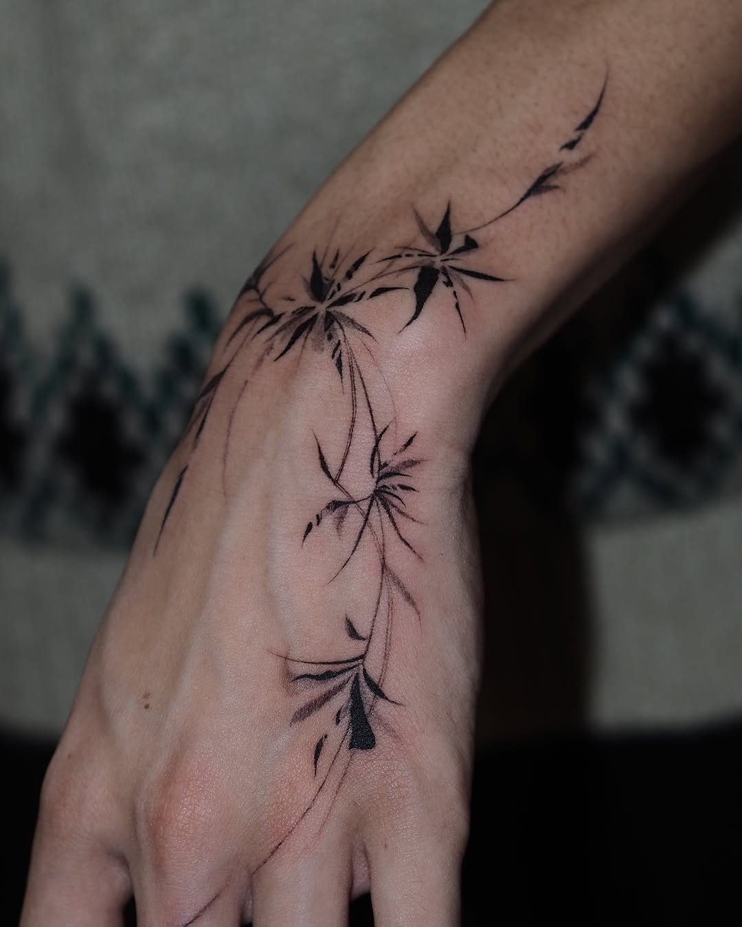 Elegant floral abstract hand tattoo design