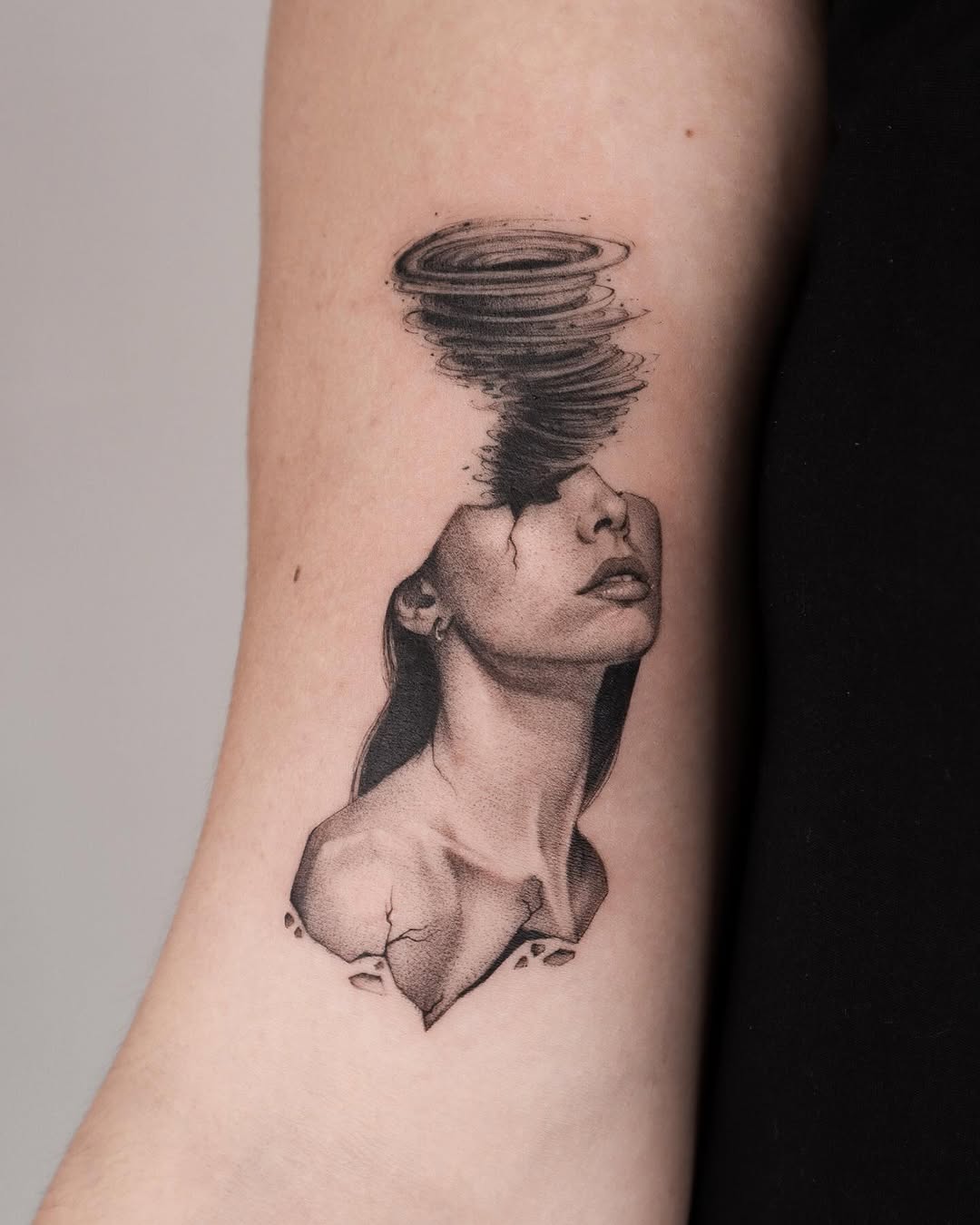 Thought-provoking abstract tattoo of a woman.