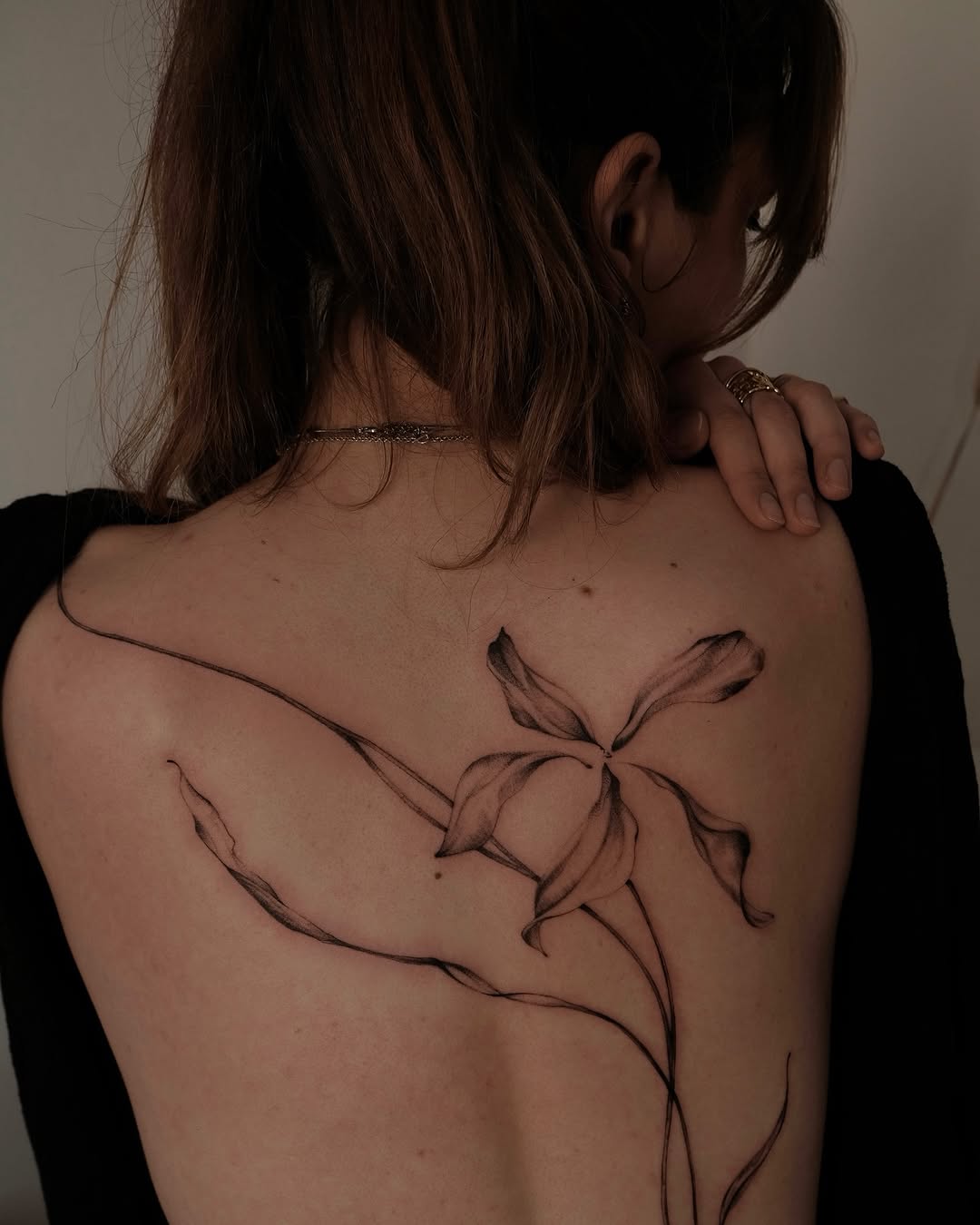 Elegant floral abstract tattoo on the back