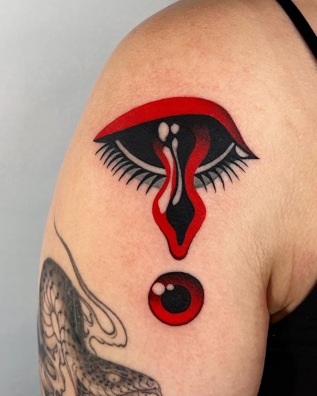 Striking abstract eye tattoo with vibrant colors