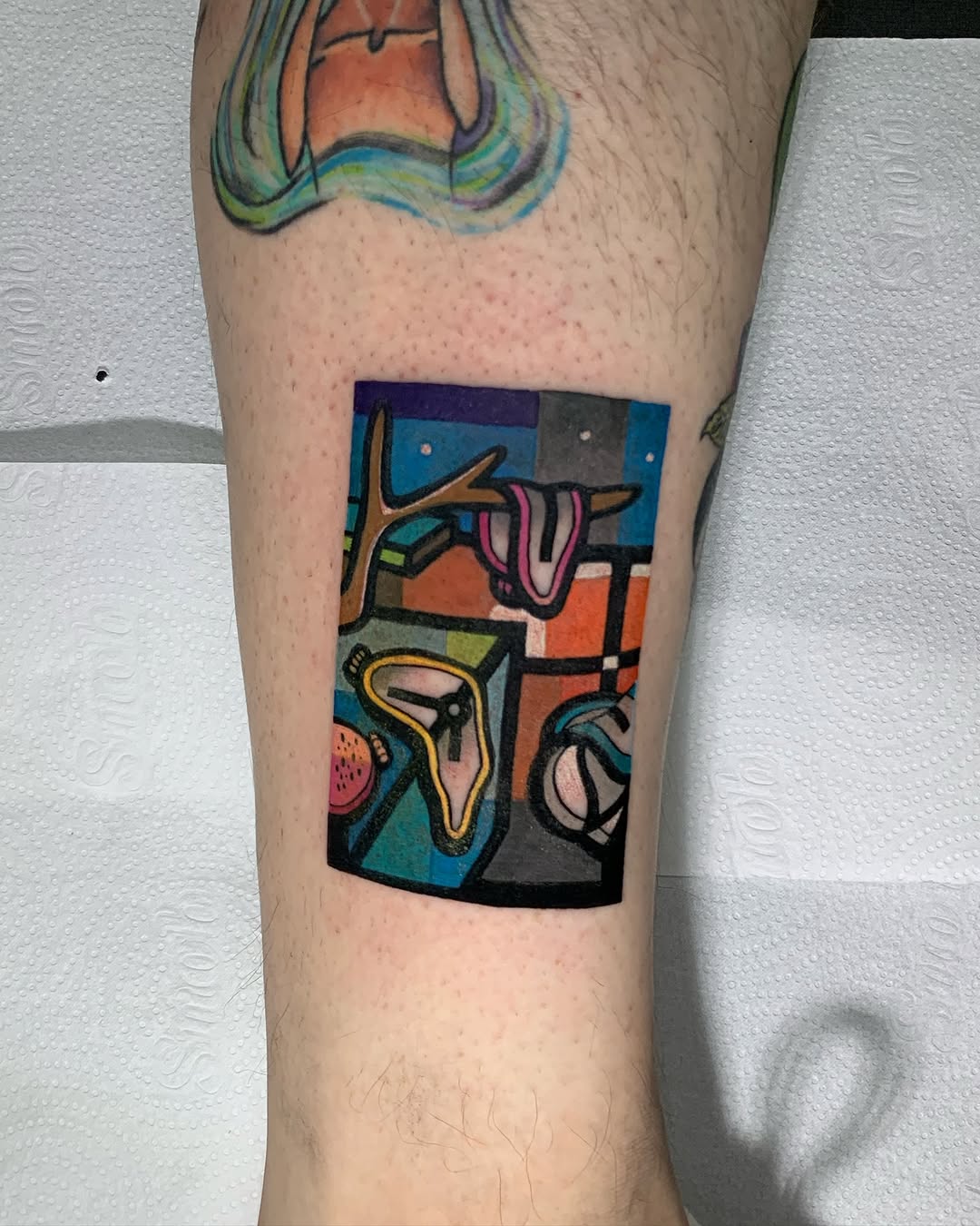 Vivid Salvador Dali-inspired tattoo with surreal elements