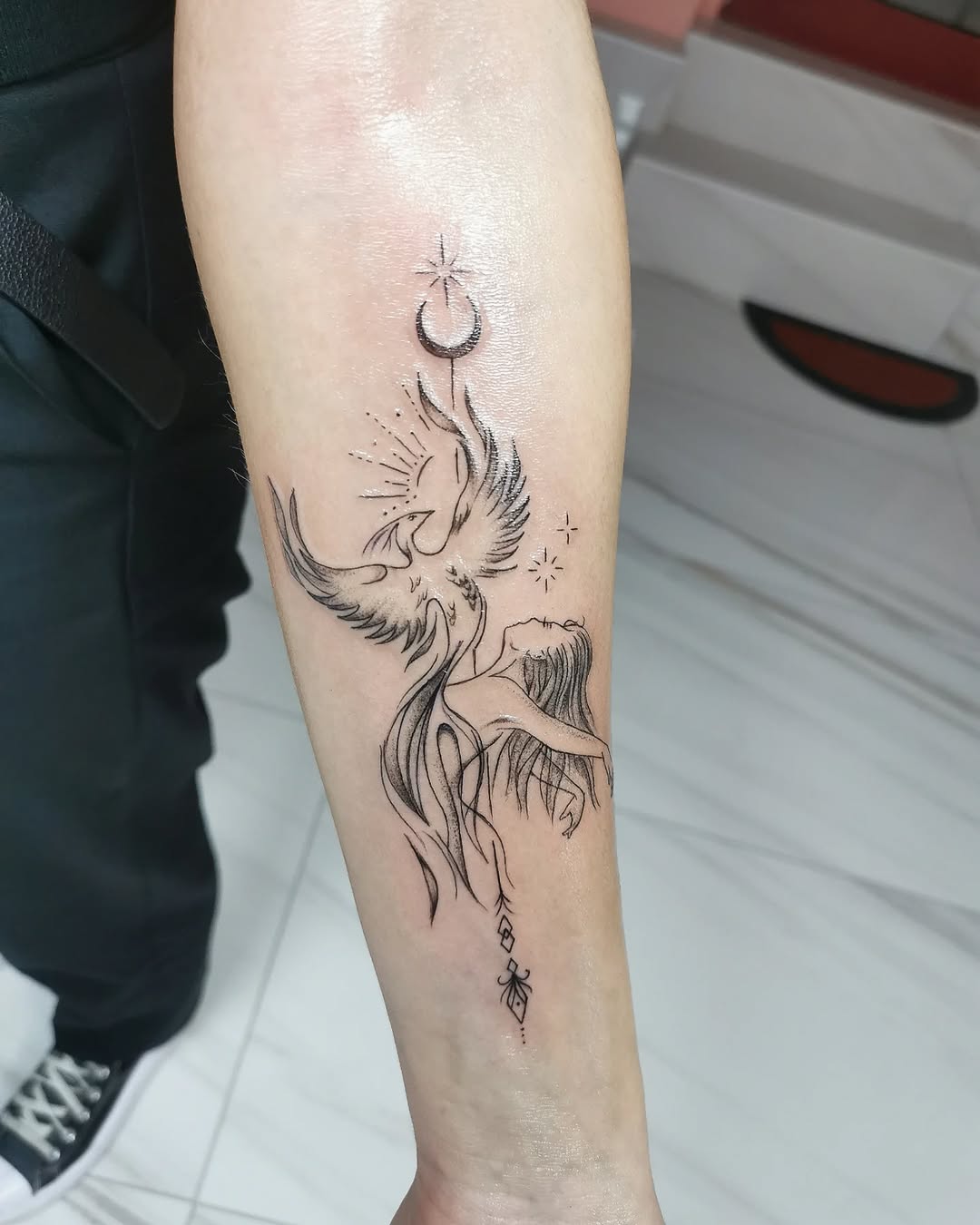 Elegant phoenix tattoo symbolizing rebirth and renewal