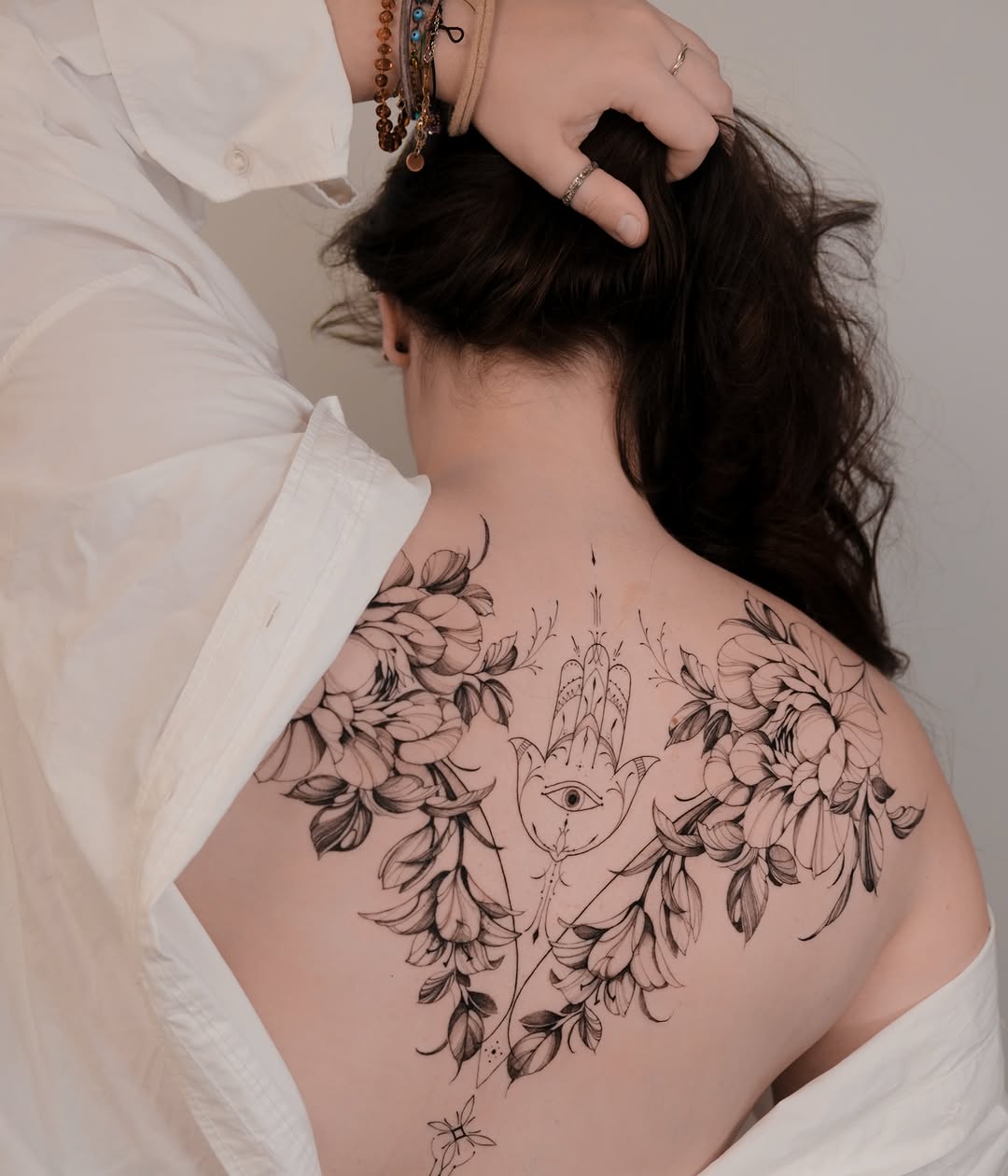 Intricate floral hamsa with mystical eye design