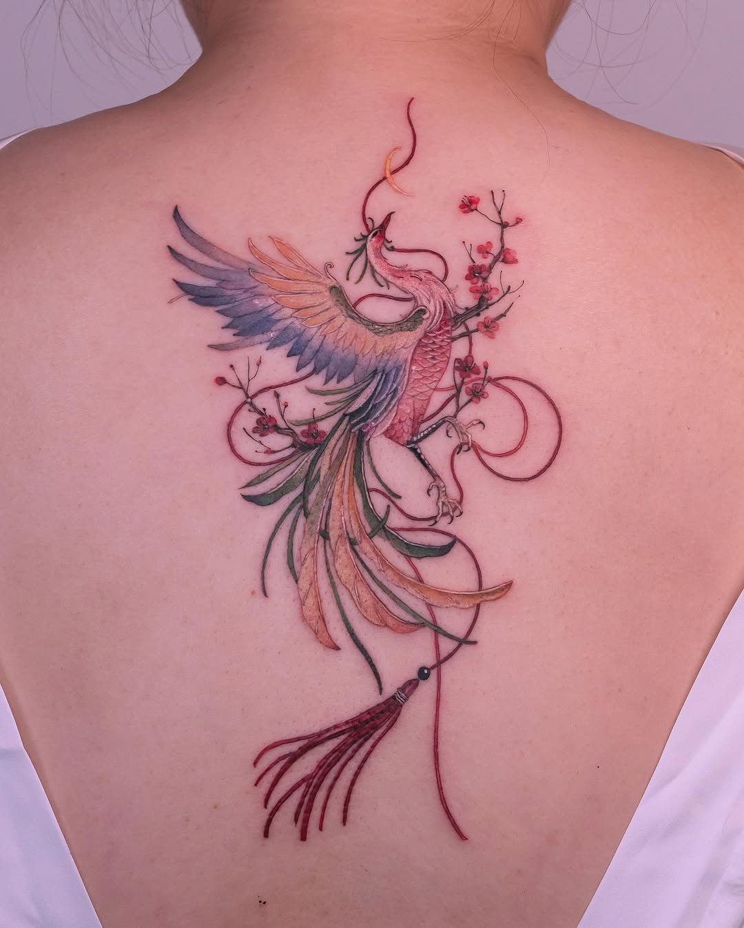 Elegant phoenix tattoo symbolizing renewal and beauty