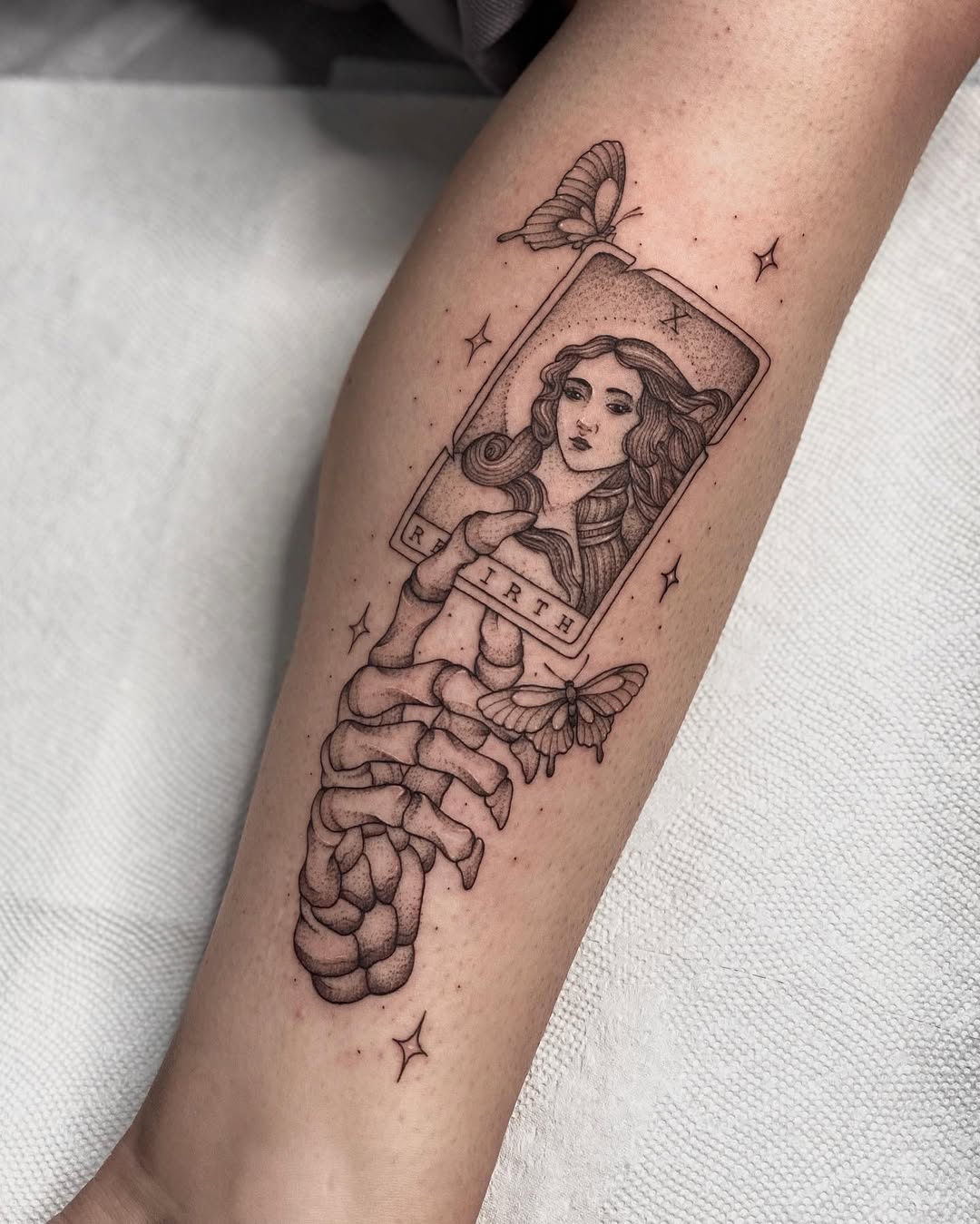Vintage rebirth tattoo with ethereal themes
