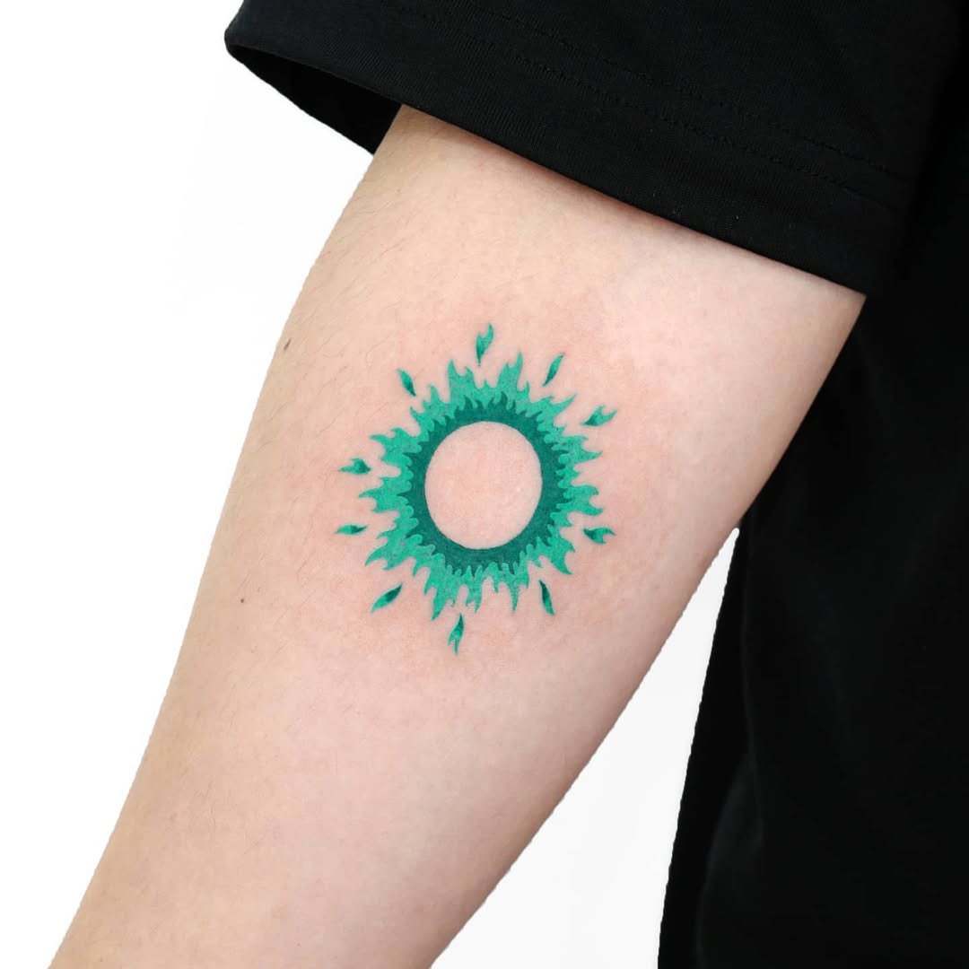 Vibrant sunburst tattoo symbolizing rebirth