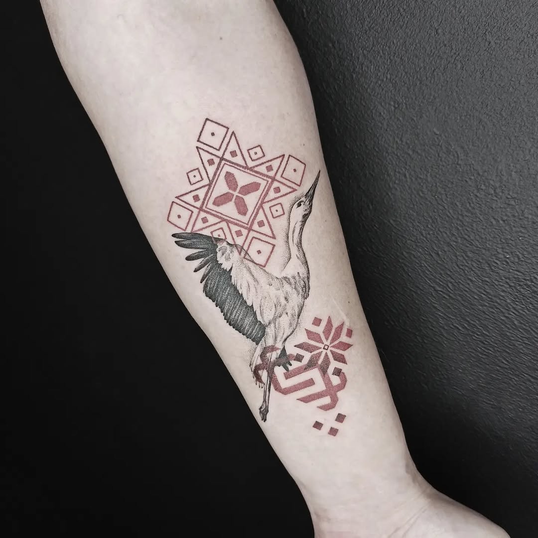 Elegant crane tattoo symbolizing rebirth and hope