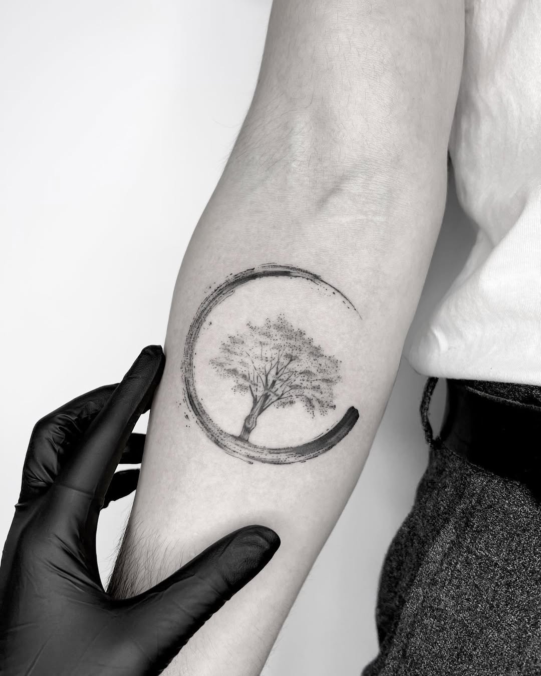 Elegant tree tattoo symbolizing rebirth and renewal