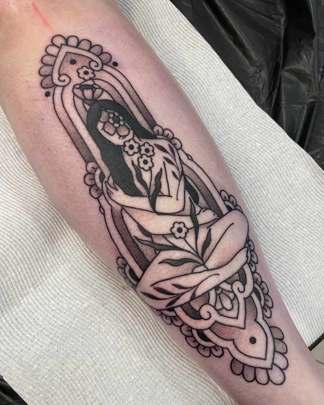 Symbolic tattoo representing renewal and femininity