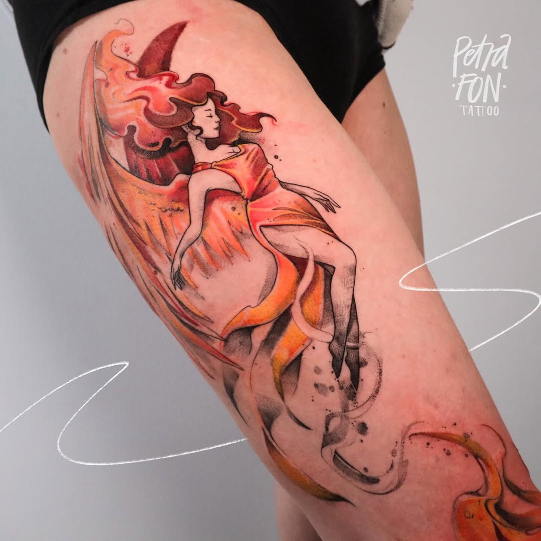 Colorful phoenix-inspired rebirth tattoo on thigh
