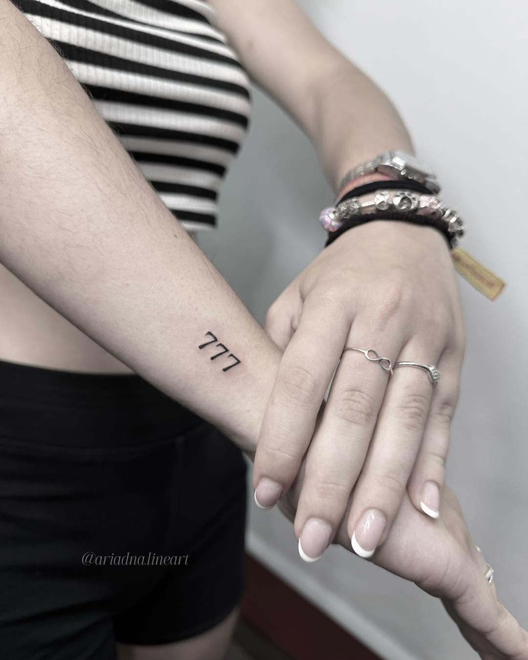 Minimalist 777 tattoo with striking simplicity