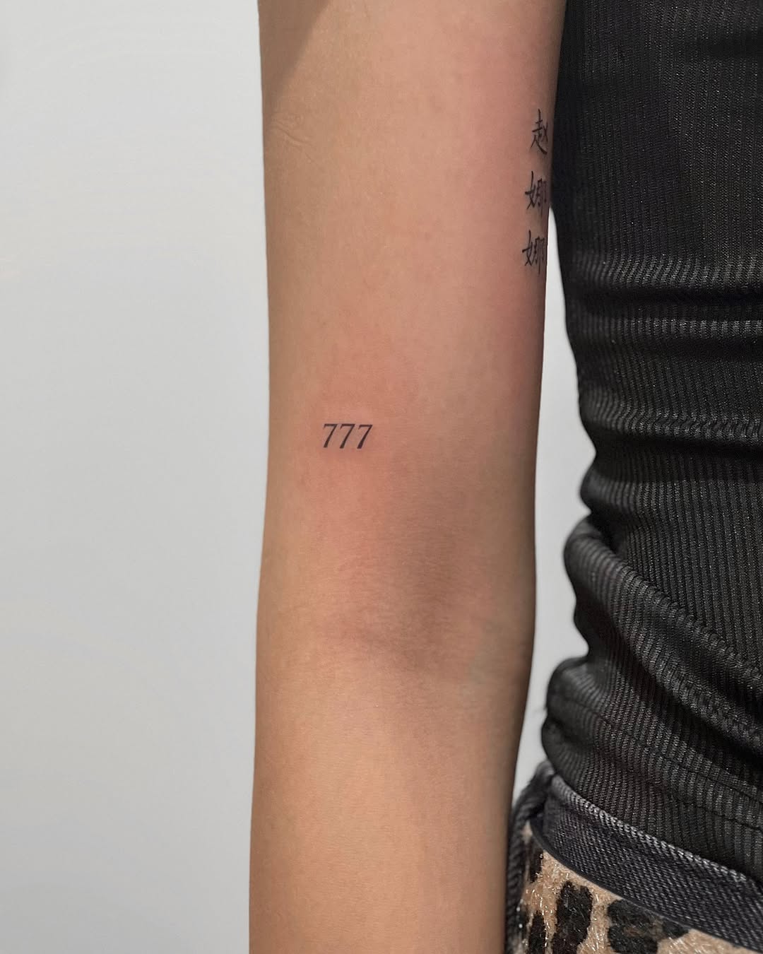 Minimalist 777 Tattoo on the Arm