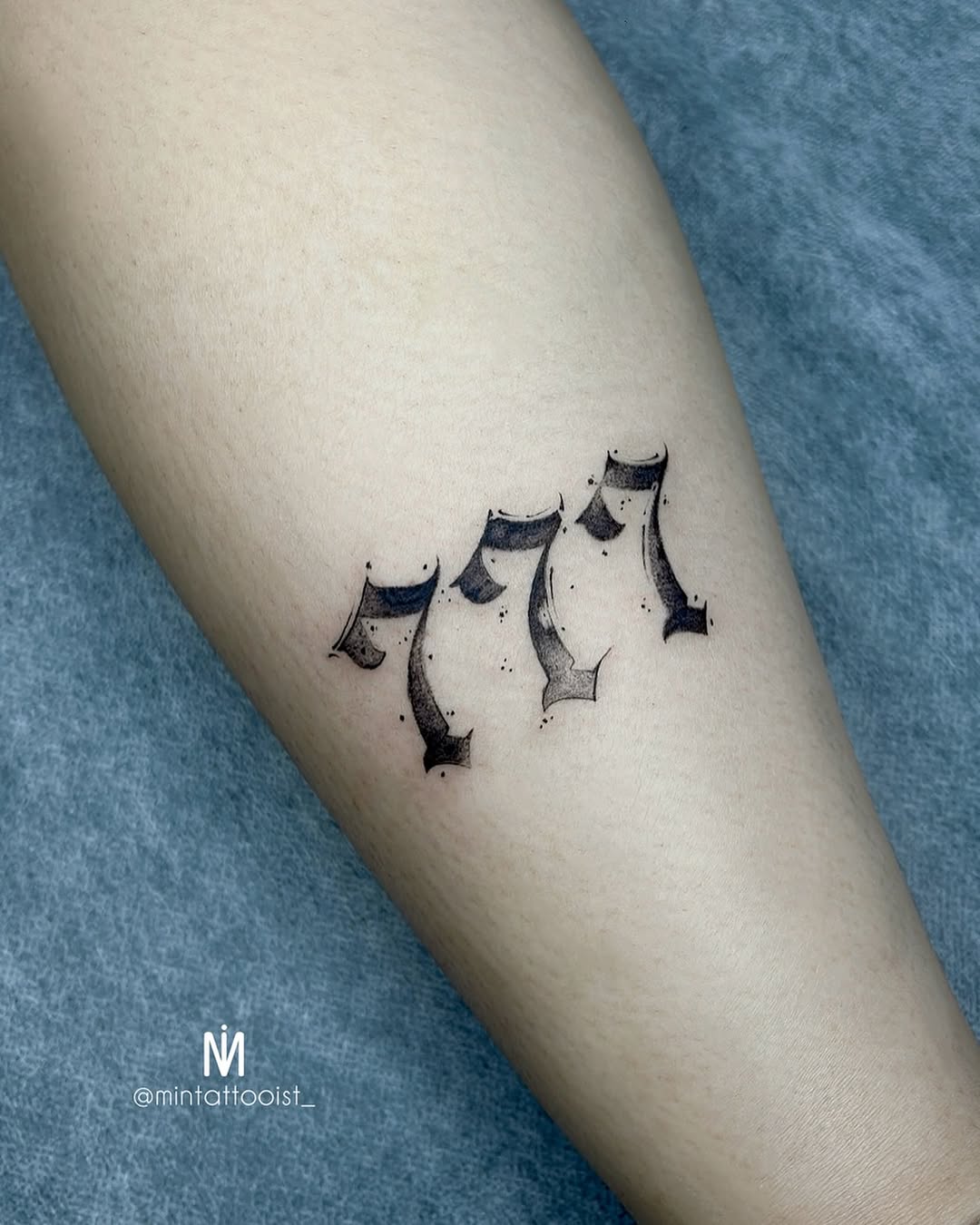 Stylish 777 tattoo with intricate design elements