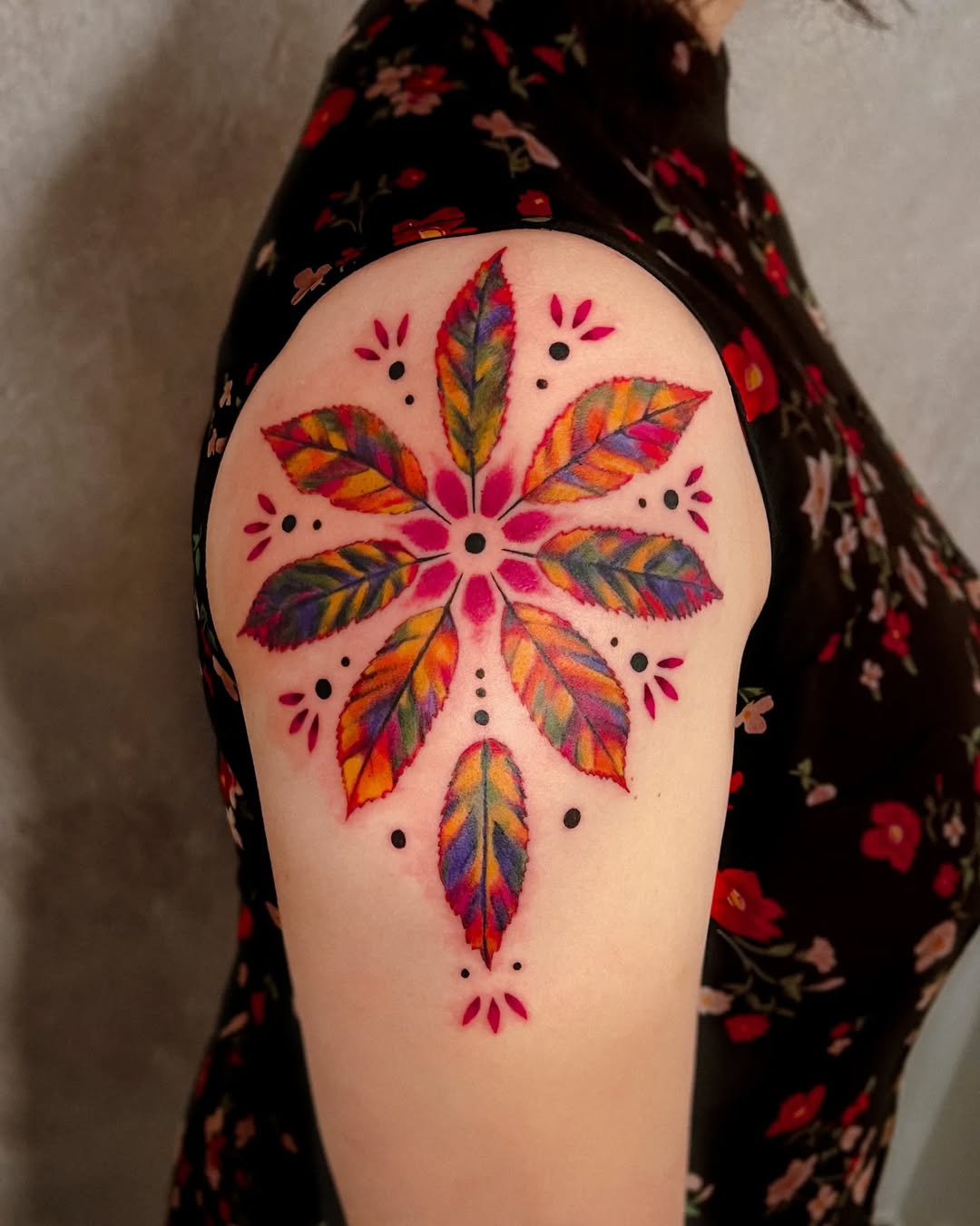 Vibrant mandala tattoo with floral elements
