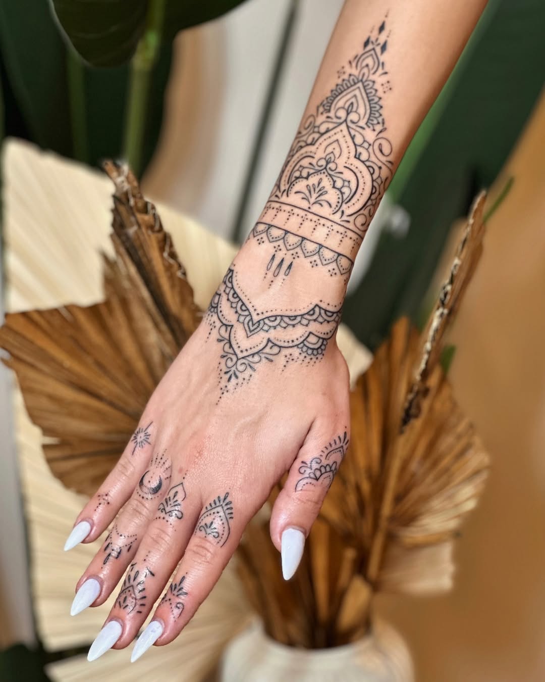 Elegant mandala tattoo adorning the hand