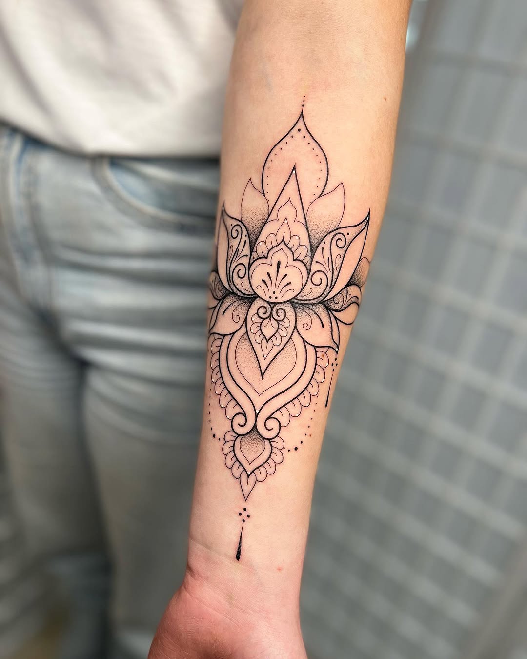 Elegant Mandala Tattoo Featuring a Lotus Flower