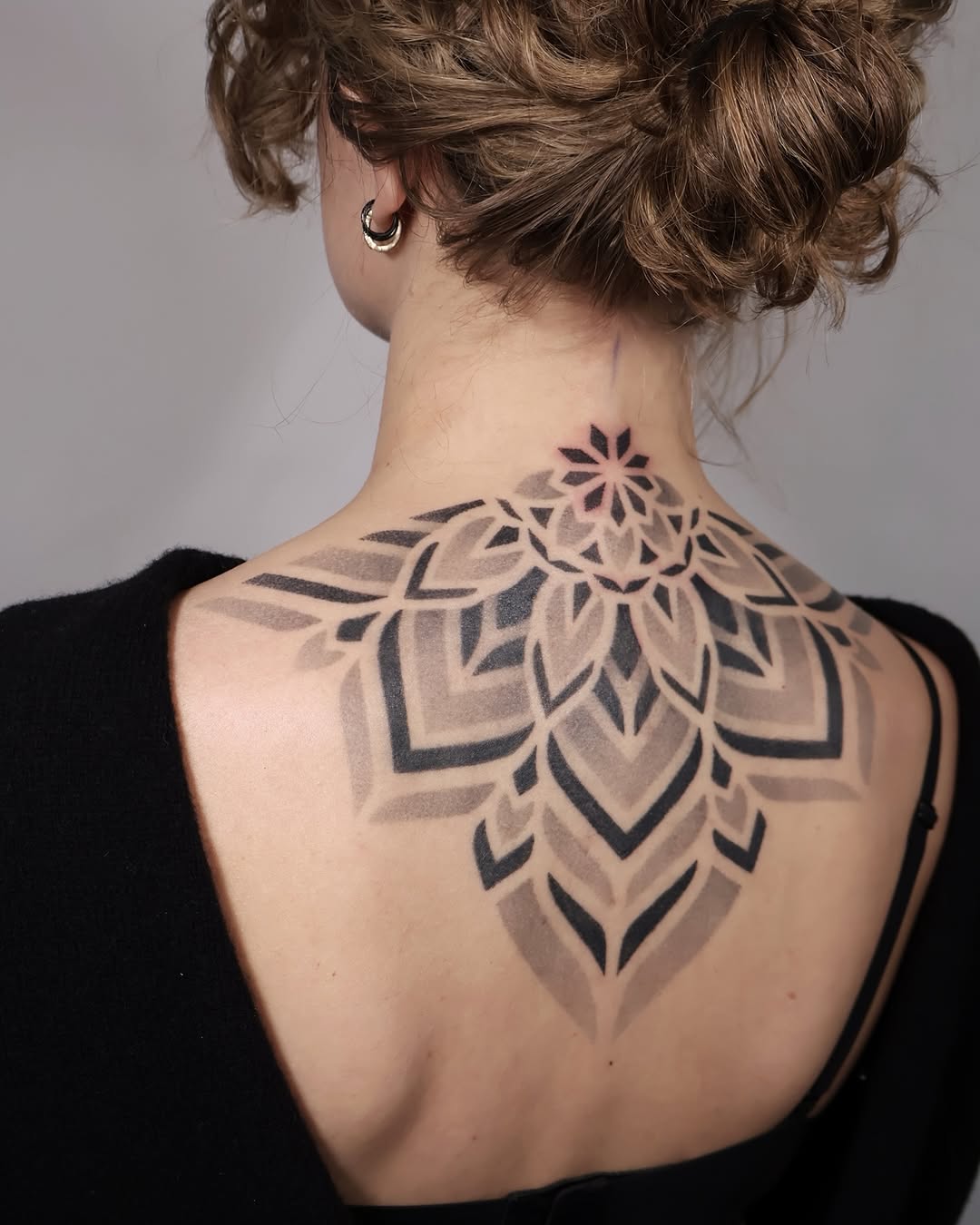 Stunning Mandala Tattoo Gracing the Back