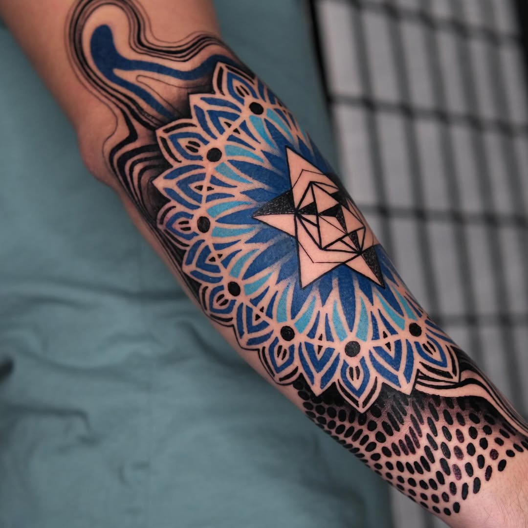 Vibrant mandala tattoo on forearm
