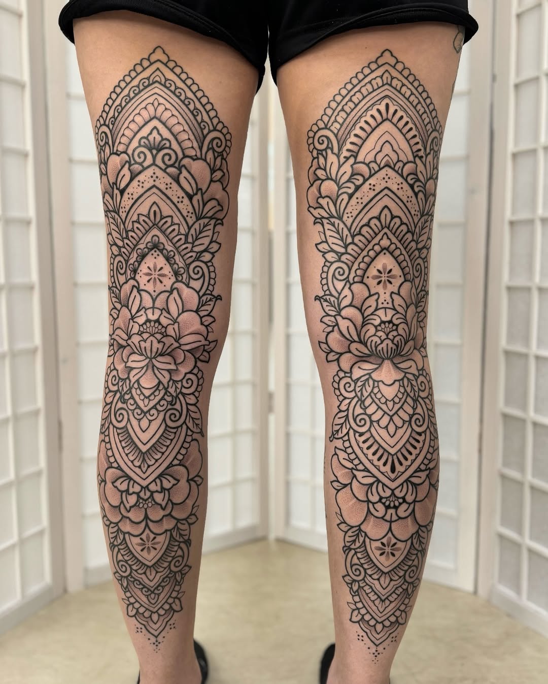 Exquisite blackwork mandala leg tattoos