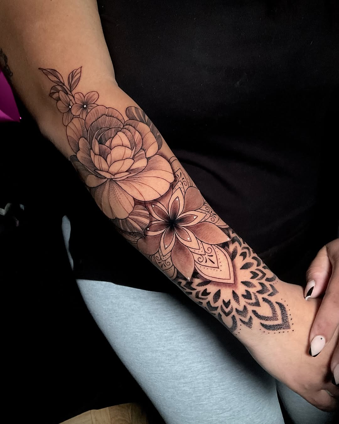 Intricate floral mandala arm tattoo design