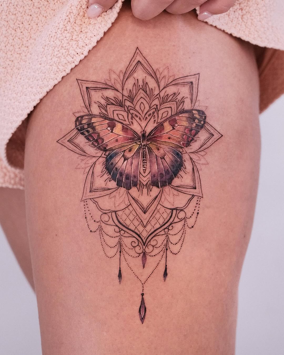 Intricate butterfly mandala tattoo design