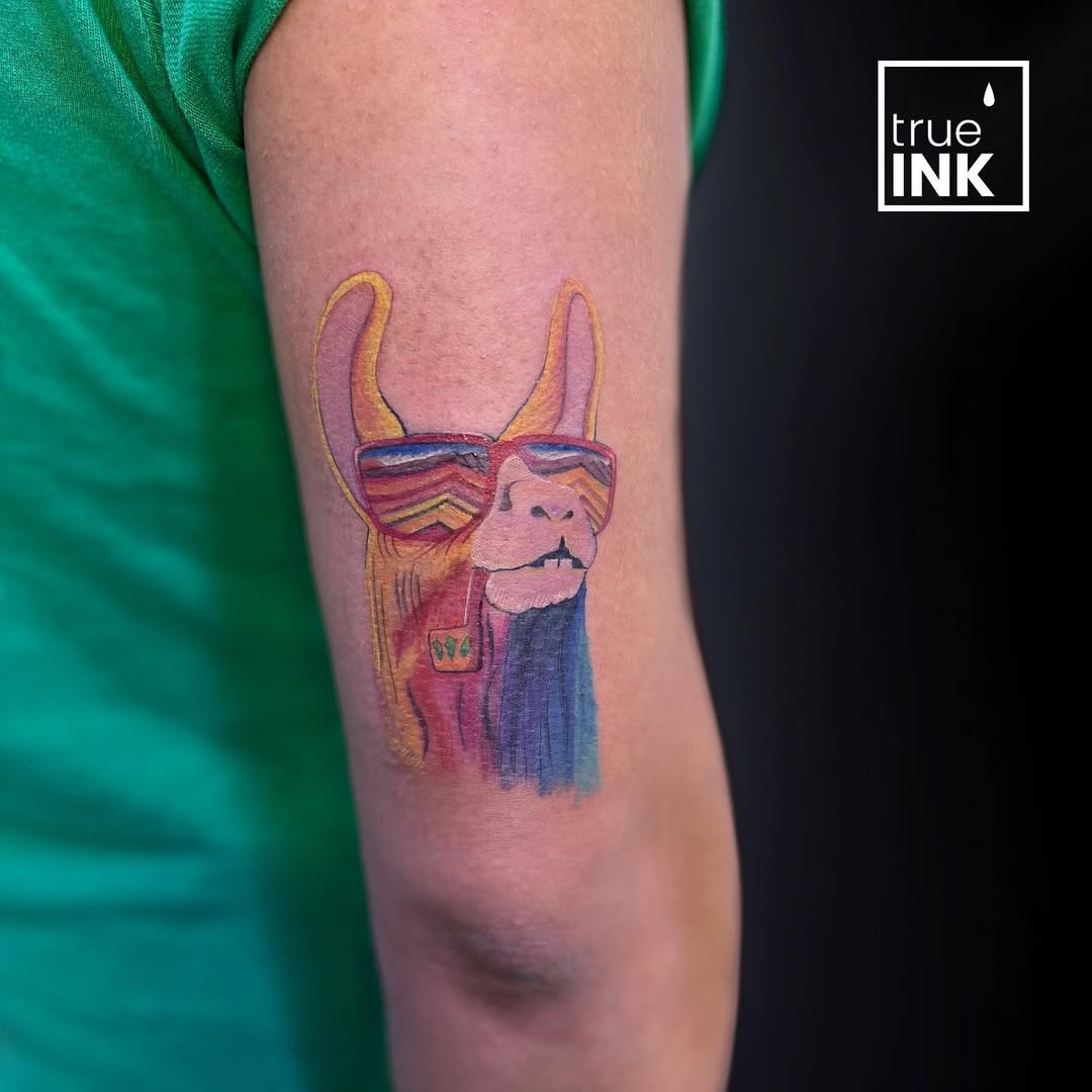 Vibrant llama tattoo in stylish sunglasses
