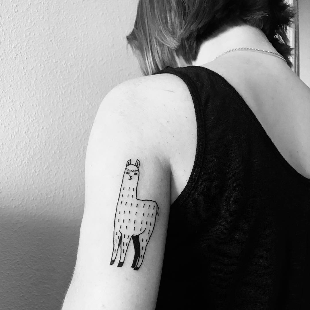 Charming minimalist llama tattoo on arm