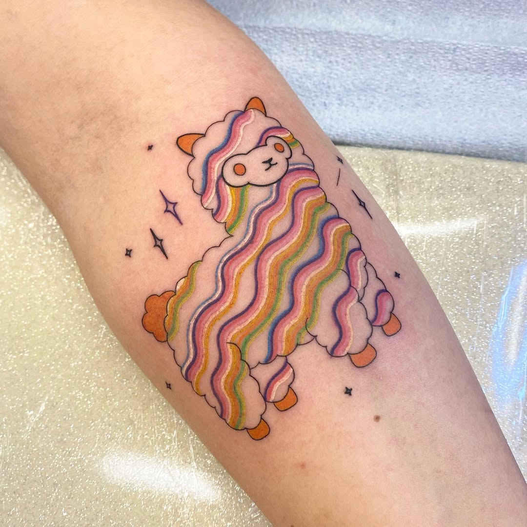 Vibrant llama tattoo with playful rainbow hues