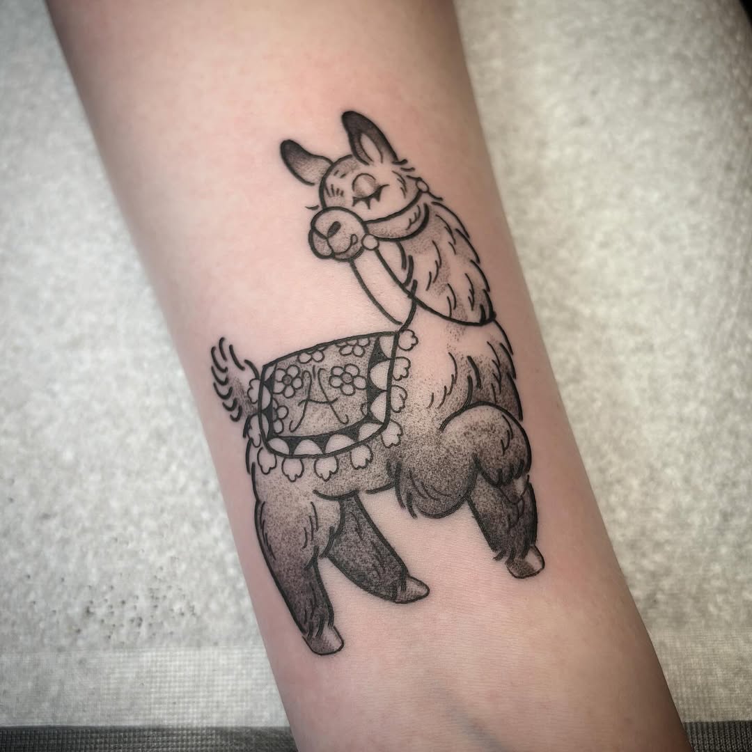 Playful llama tattoo showcasing vibrant personality