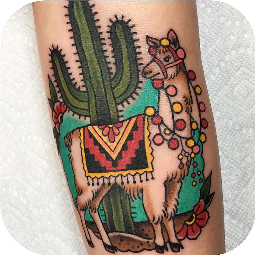 Vibrant llama tattoo with desert vibes