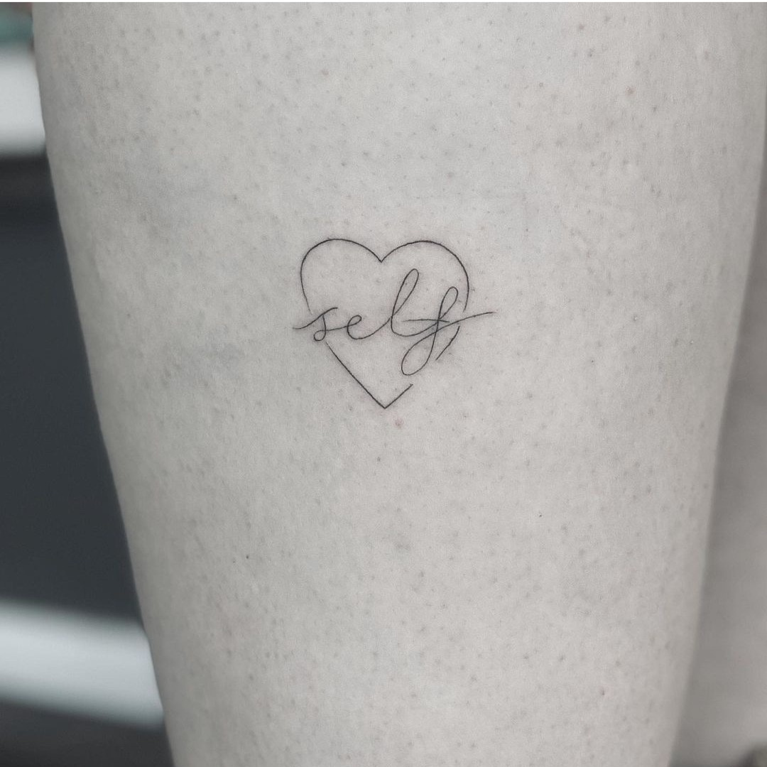 Minimalist self-love heart tattoo