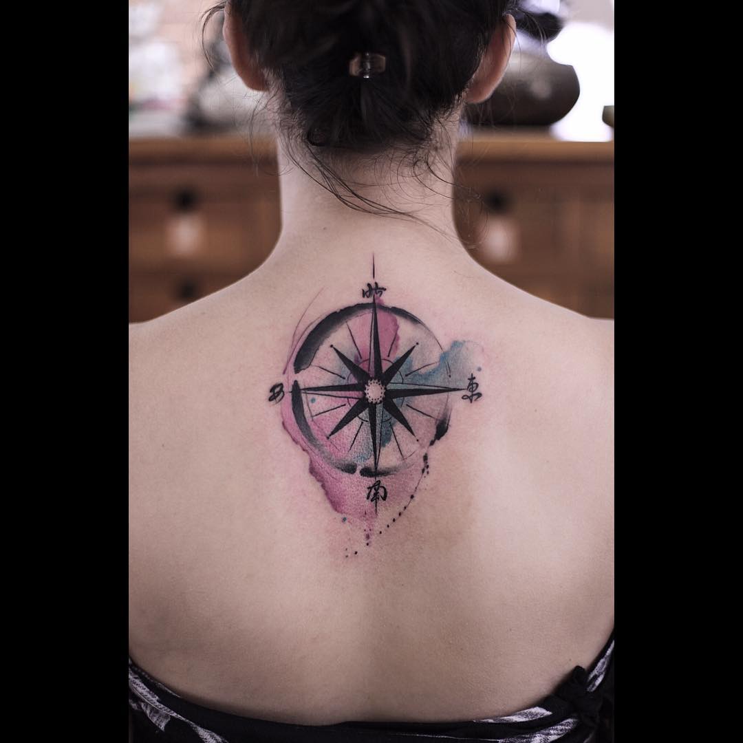 Vibrant Compass Tattoo on the Back