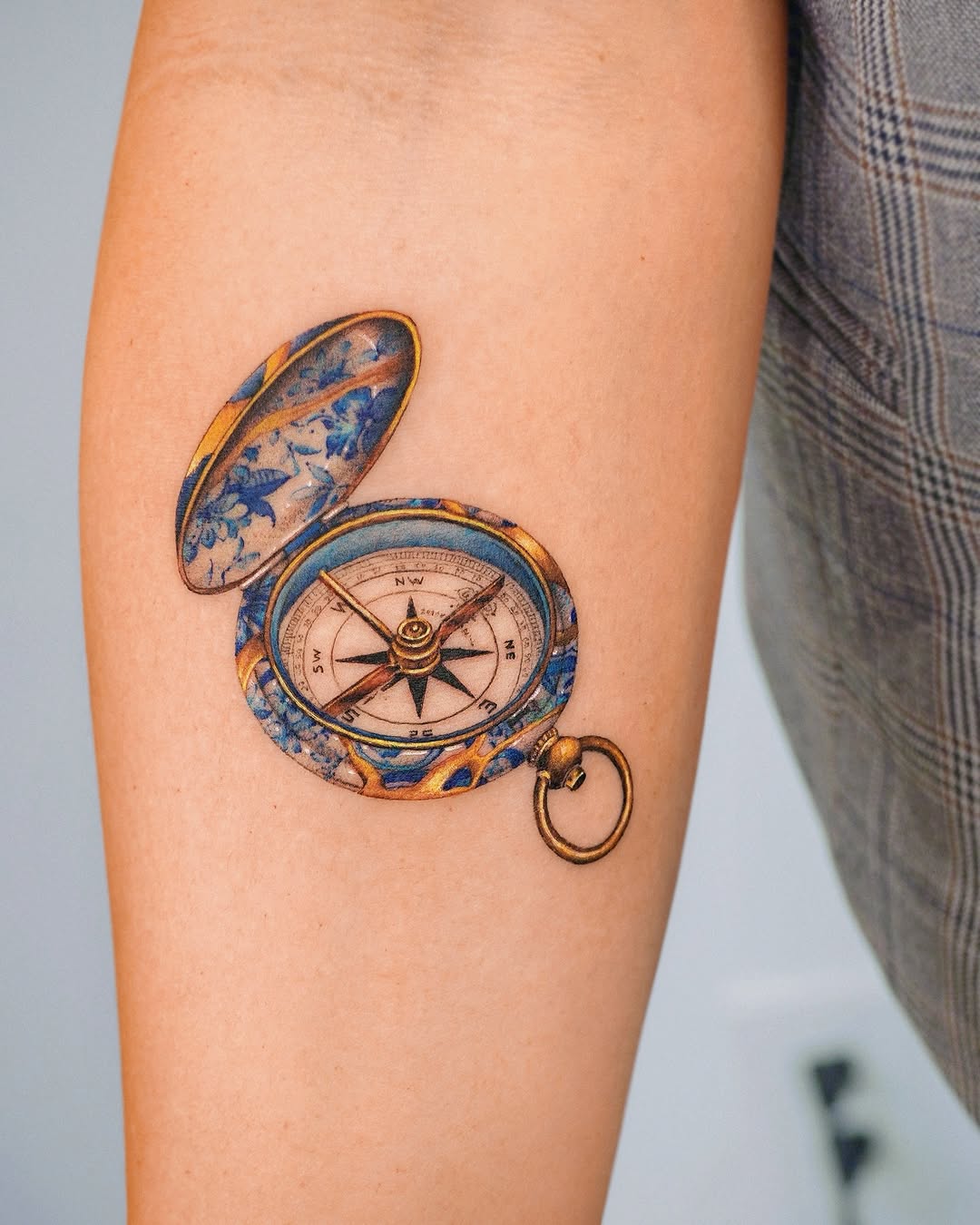 Vintage compass tattoo with intricate detailing