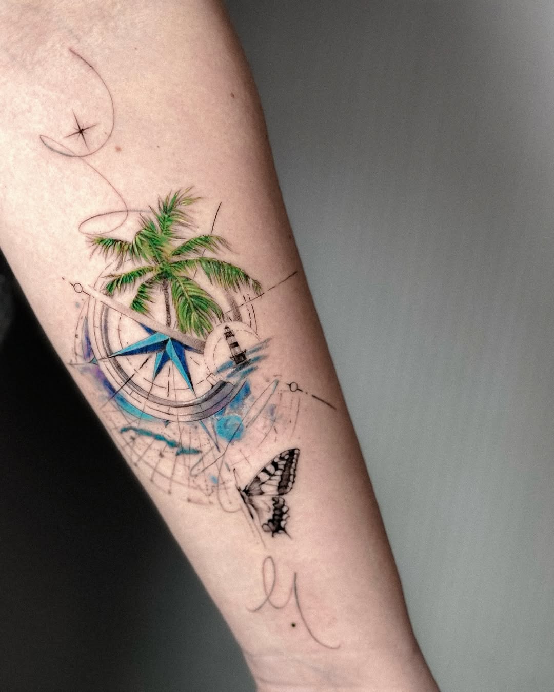 Vibrant Compass Tattoo with Tropical Elements