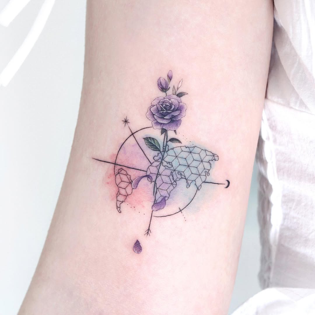 Elegant compass tattoo with floral elements