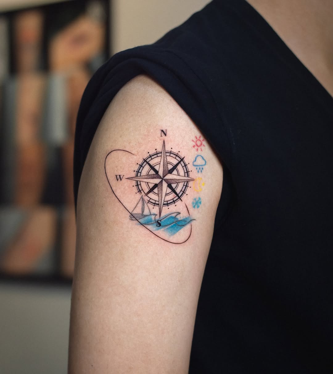 Colorful compass tattoo with nature elements