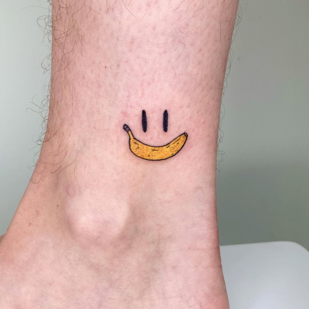 Cute banana smiley tattoo for cheerful vibes