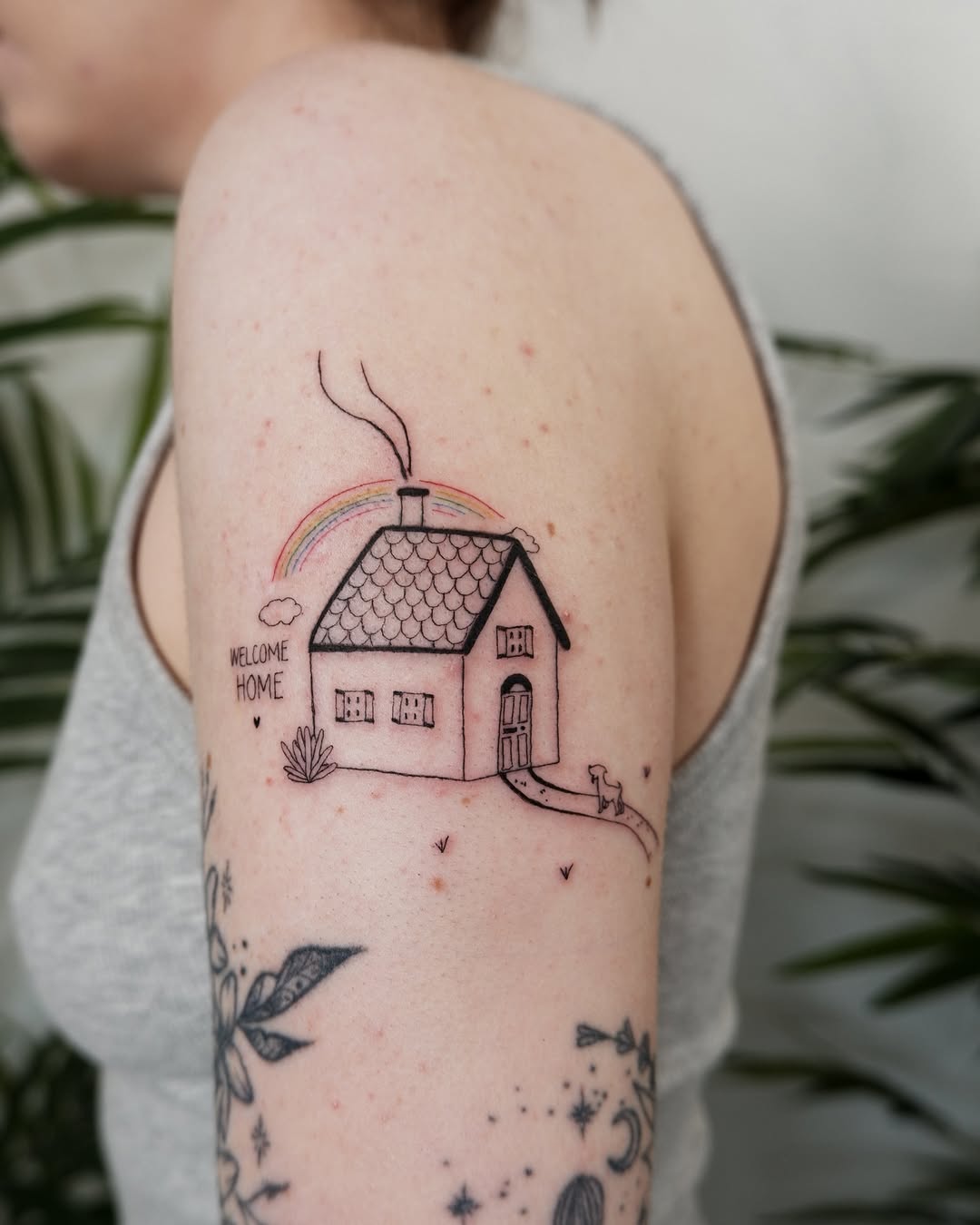 Charming house tattoo with a welcoming vibe