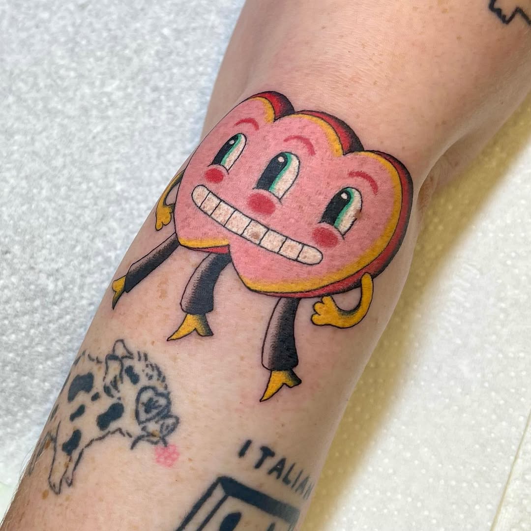 Colorful heart character tattoo brings joy