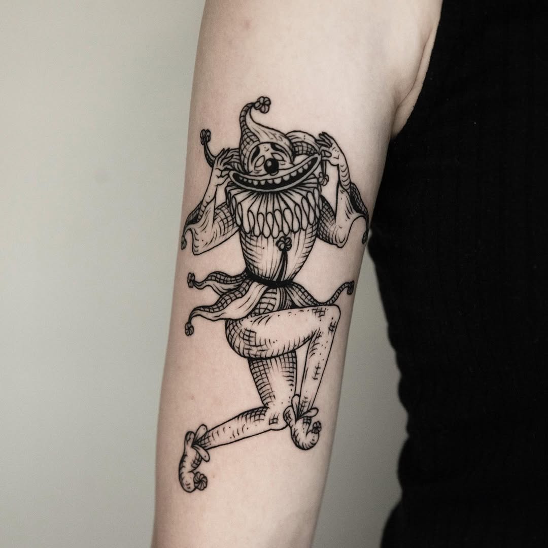 Cheerful jester tattoo exuding playful vibes