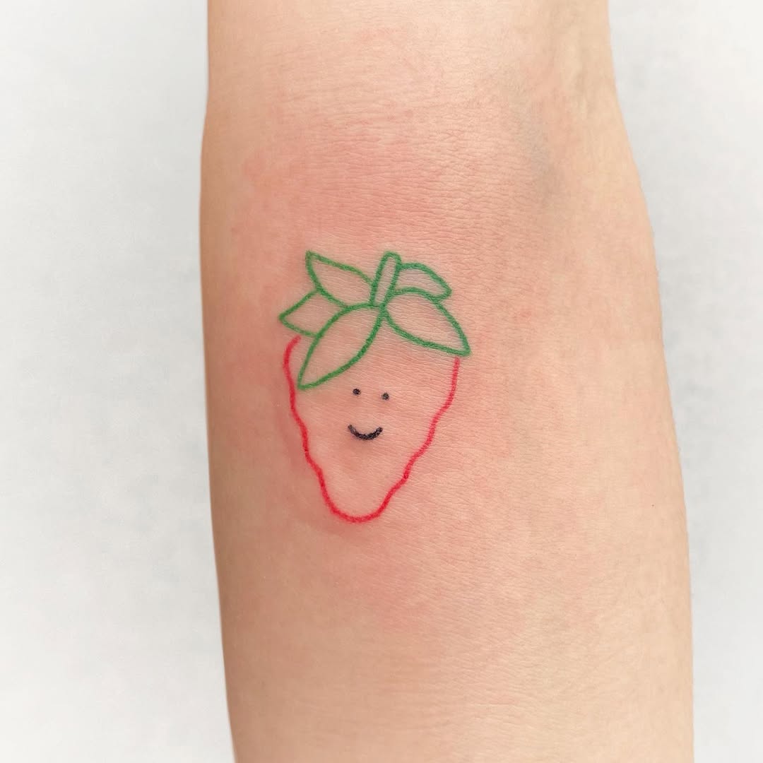 Adorable happy strawberry tattoo design