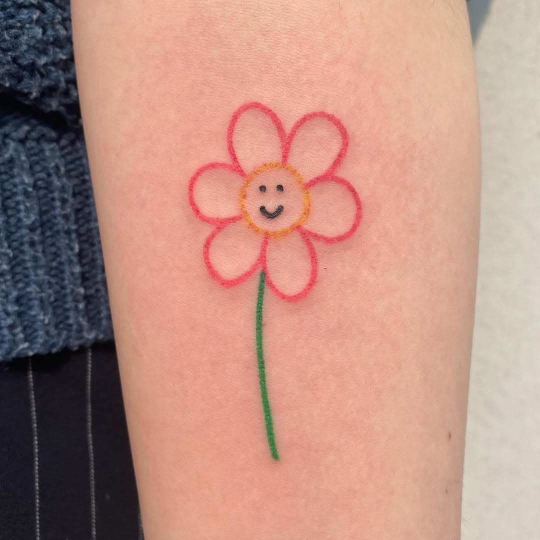 Charming smiley flower tattoo for positivity