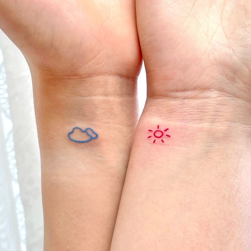 Delicate cloud and sun tattoos for mom and daughter