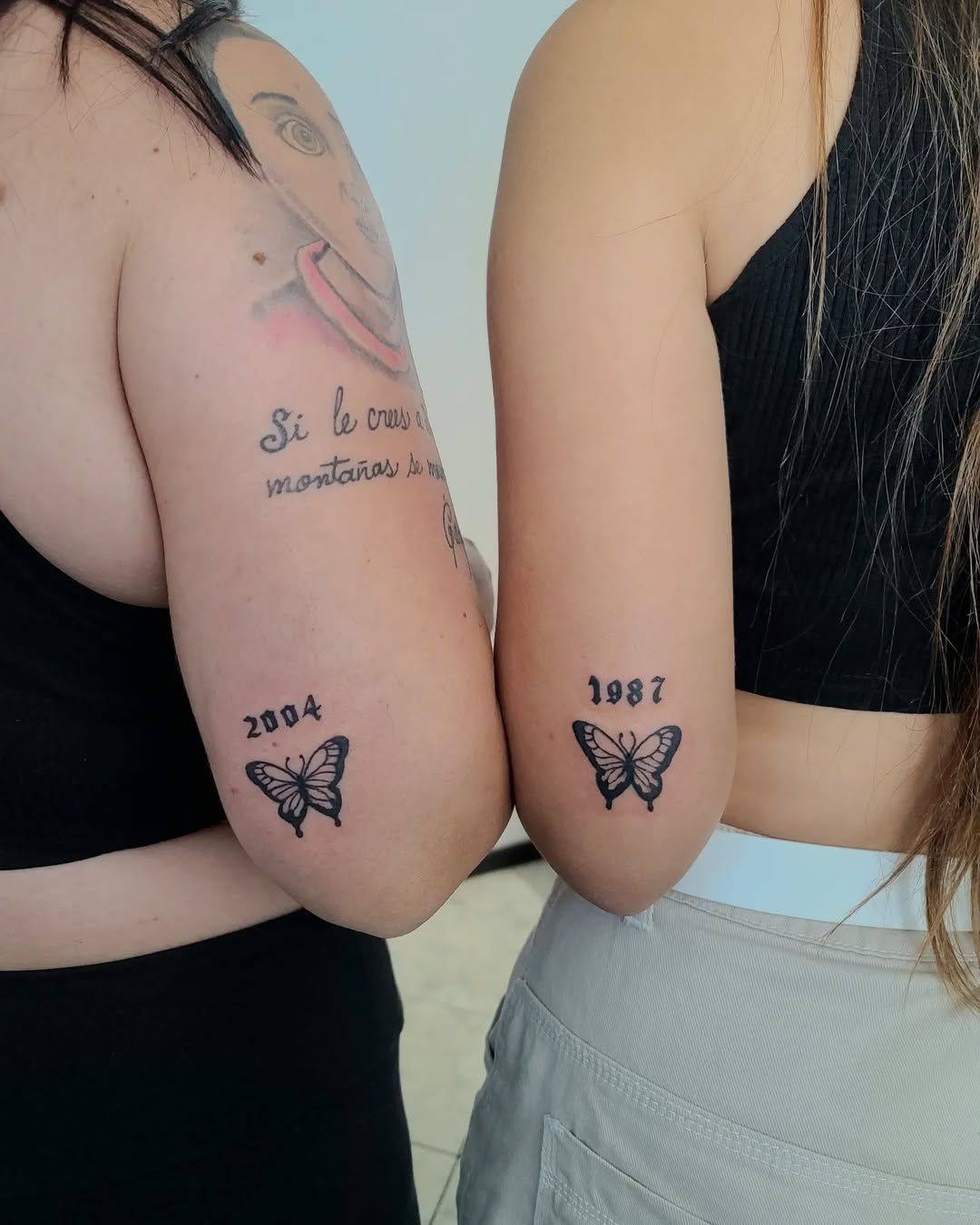 Symbolic butterfly tattoos for mother and daughter