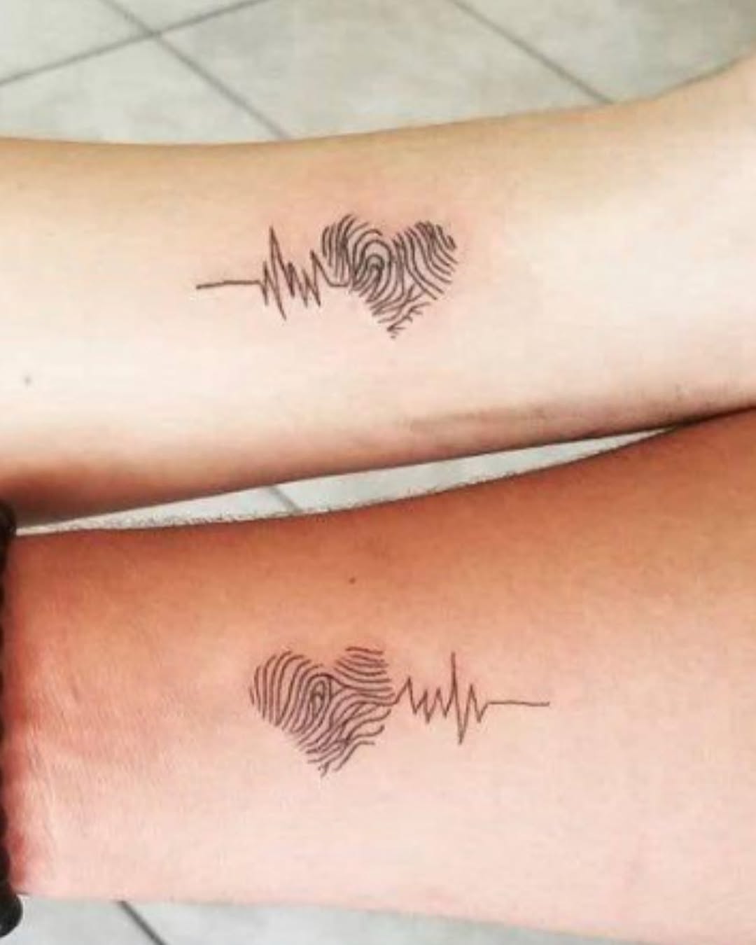 Unique bond captured in heartbeat tattoos