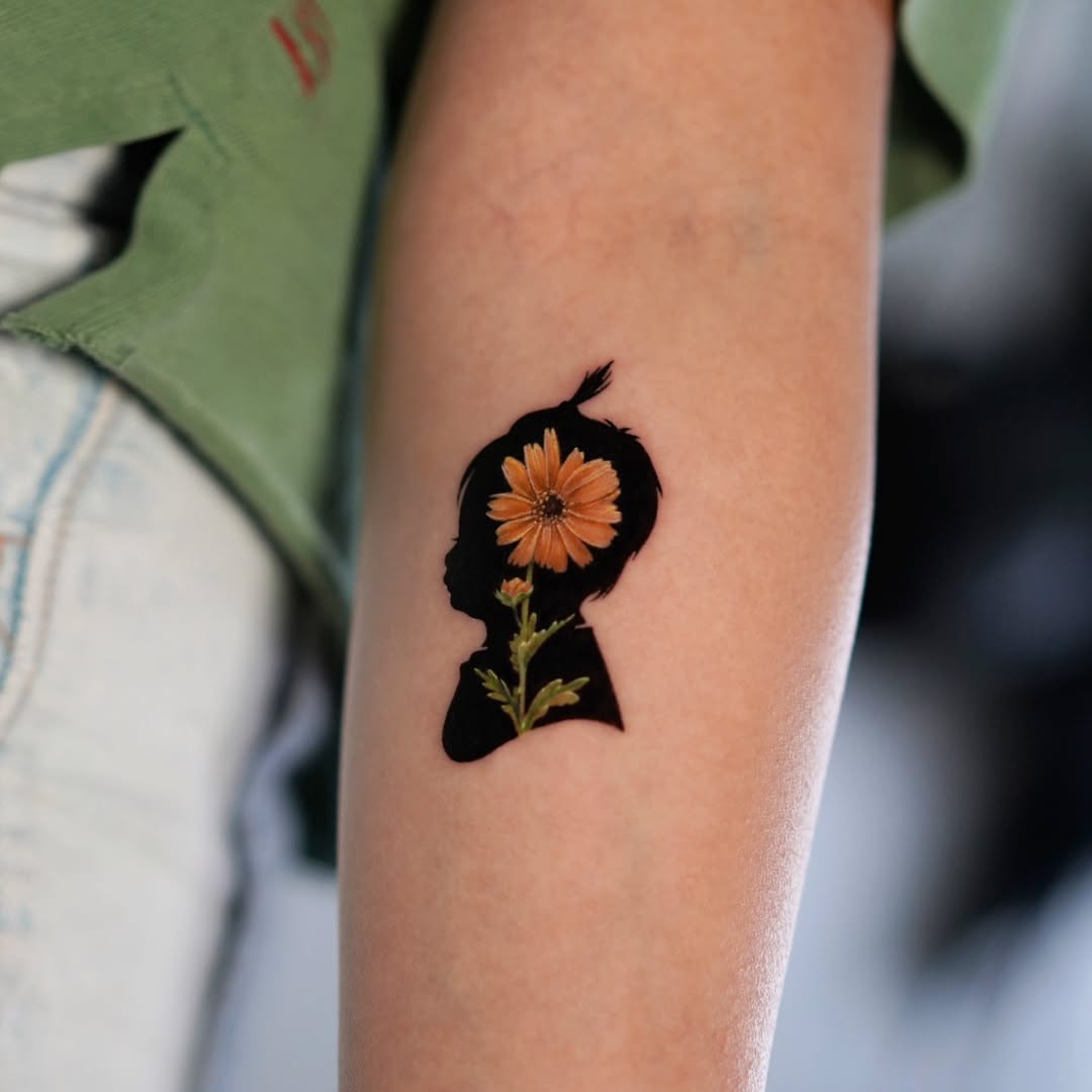 A tribute tattoo celebrating motherhood and growth
