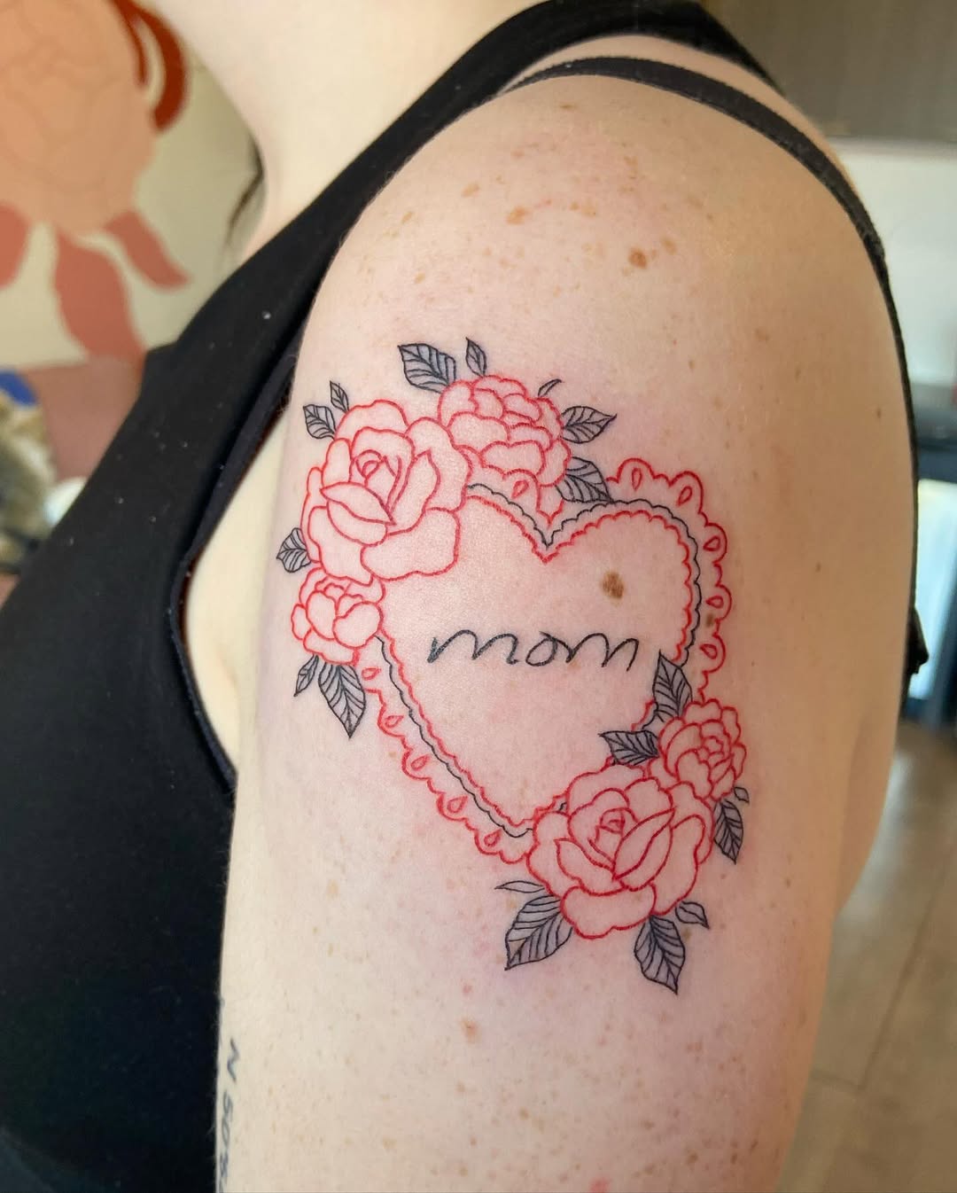 Heartfelt floral tattoo tribute to mothers