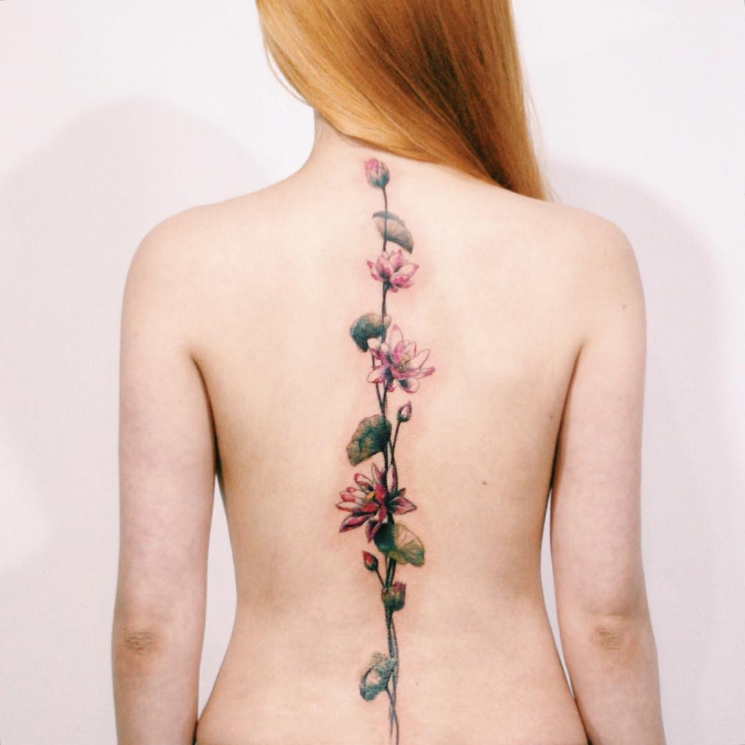 Elegant floral spine tattoo showcasing beauty and symmetry