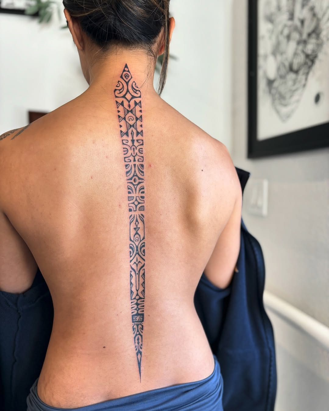 Elegant spine tattoo with intricate geometric patterns