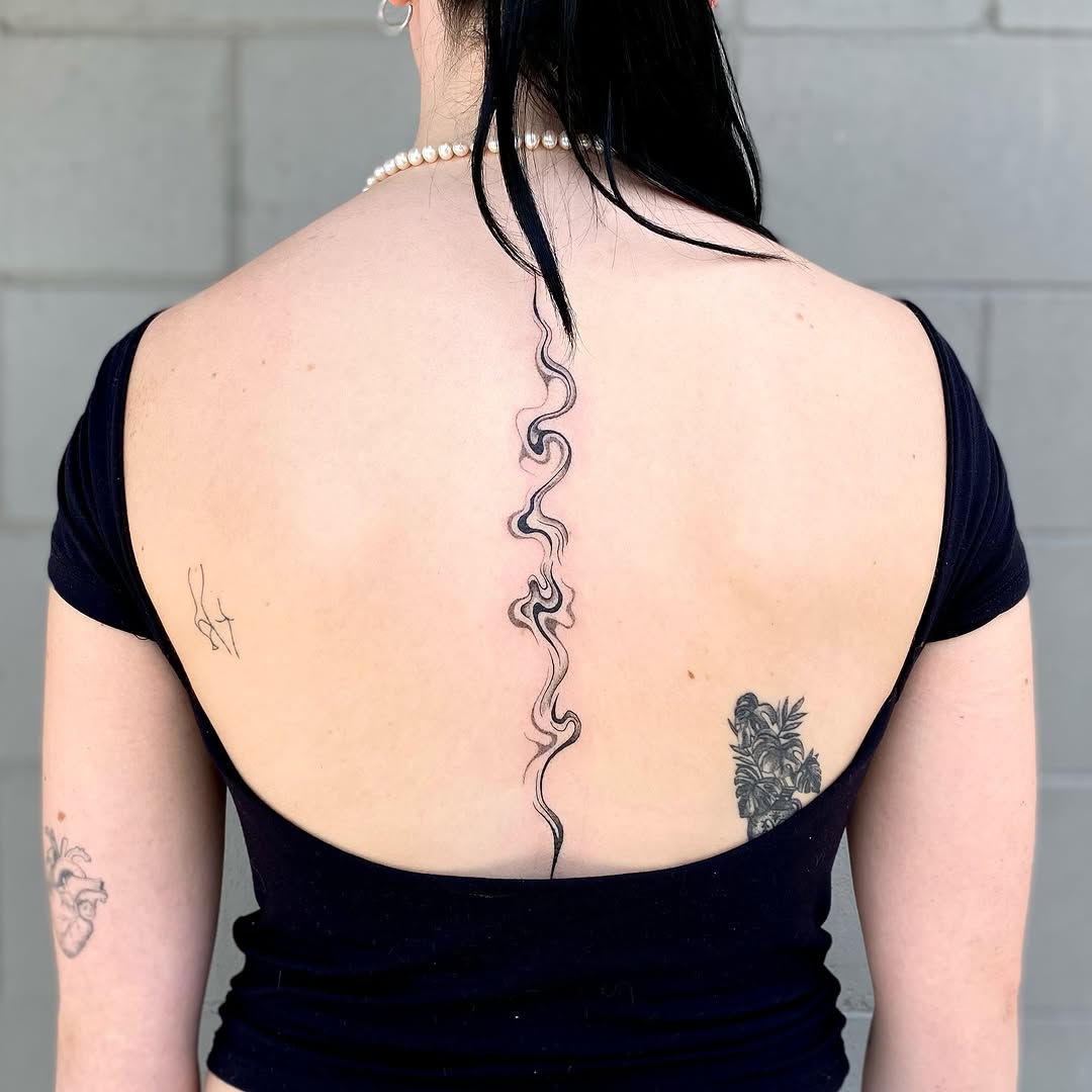 Elegant and Flowing Spine Tattoo Design